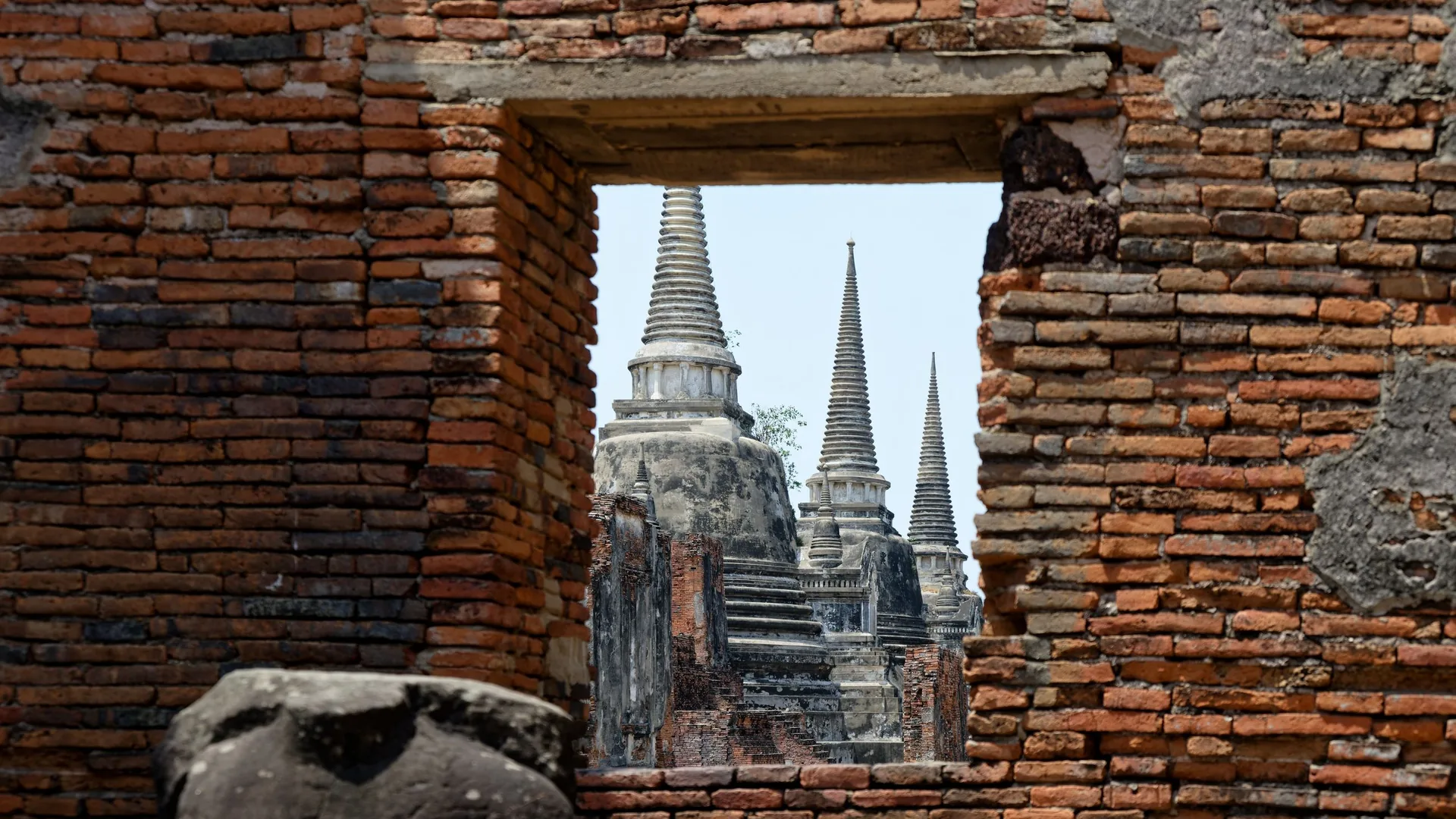 The ruined brick chedis and temples of Ayutthaya Historical Park in Thailand